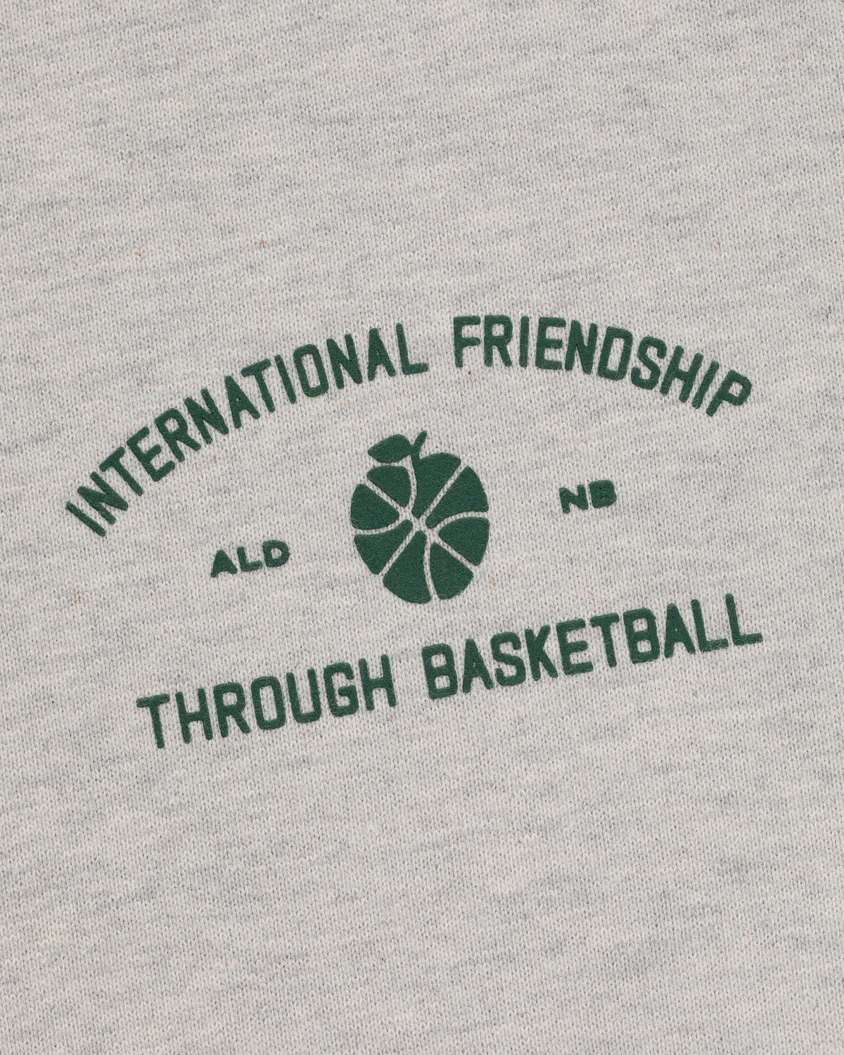 The ALD/New Balance SONNY NY IFTB Crewneck Sweatshirt features “International Friendship Through Basketball” with center graphic.