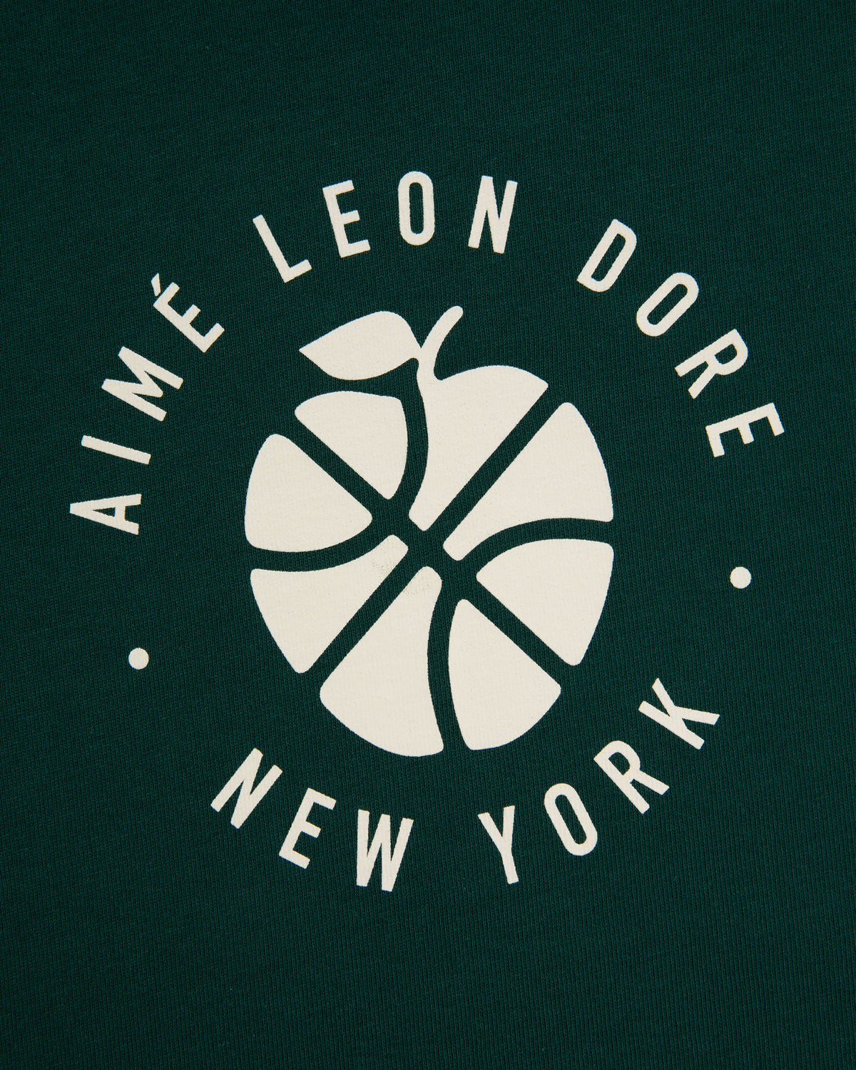 White ALD / New Balance SONNY NY Long-Sleeve Tee with “AIMÉ LEON DORE NEW YORK” text on dark green background.