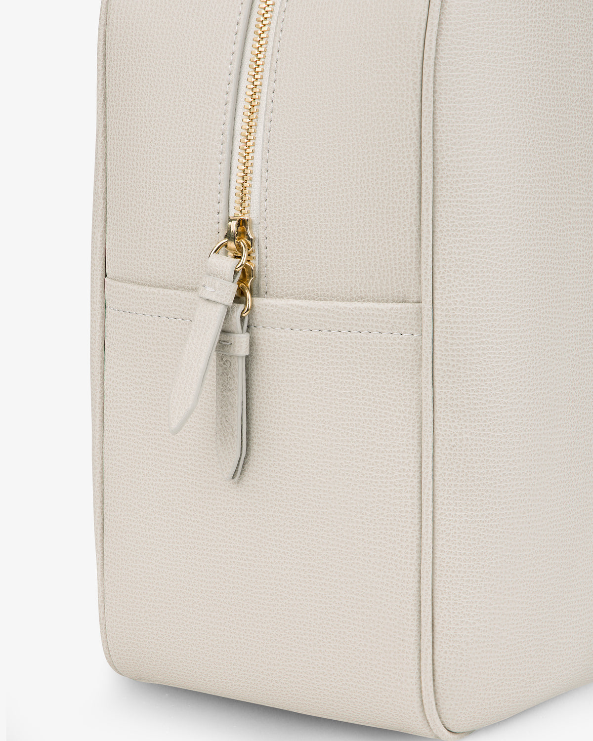 Close-up of the Full Grain Leather Briefcase Duffle in light beige with textured leather, gold zipper, and side pocket.