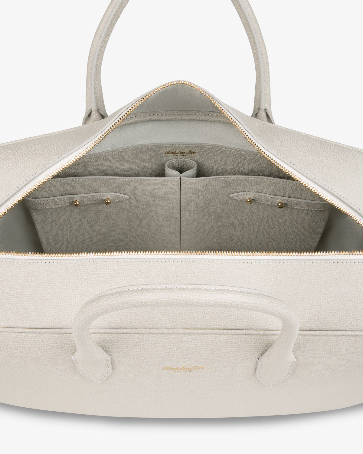 Open Full Grain Leather Briefcase Duffle with gold zipper, spacious interior, and two small inner pockets.