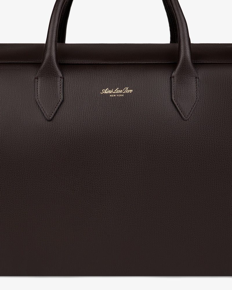 Close-up of a dark brown Full Grain Leather Briefcase Duffle with two handles and gold Alexander Drew New York logo.