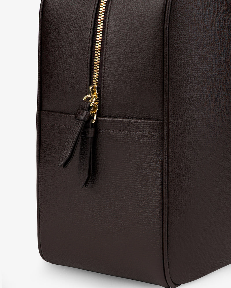 Close-up of the Full Grain Leather Briefcase Duffle in dark brown with a gold zipper and two leather pulls.
