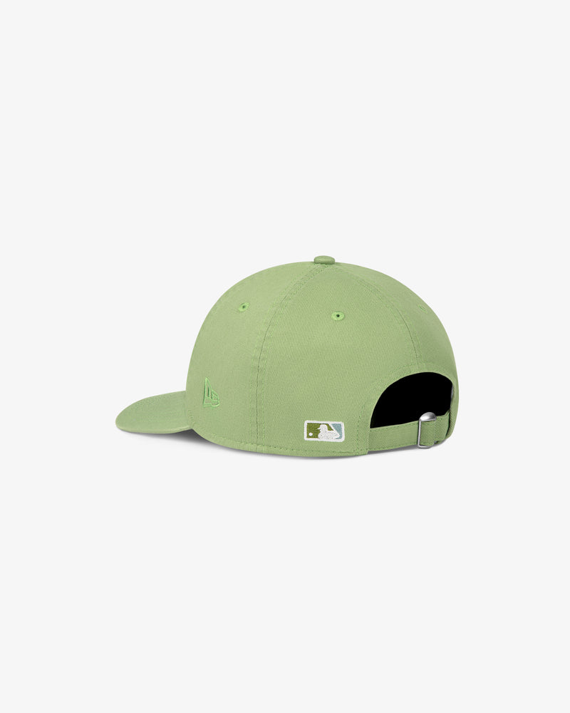 ALD / New Era Yankees Ballpark Hat in light green, shown from the back with adjustable strap and white logo above opening.