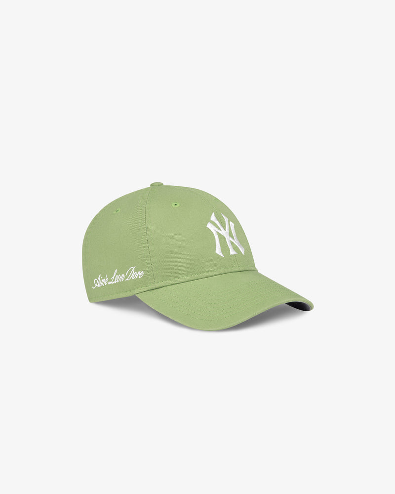 Light green ALD / New Era Yankees Ballpark Hat with white NY logo and Aimé Leon Dore embroidered on the side.