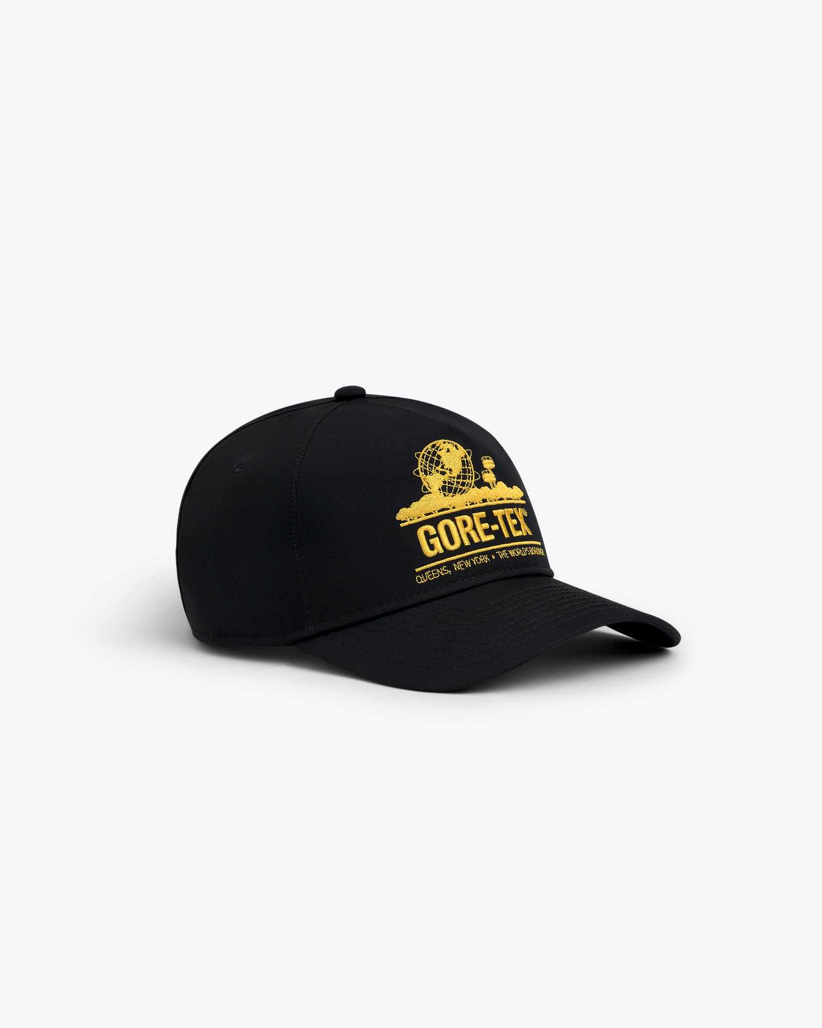 GORE-TEX Unisphere Hat: black baseball cap with curved brim and yellow GORE-TEX logo on the front, shown on white background.