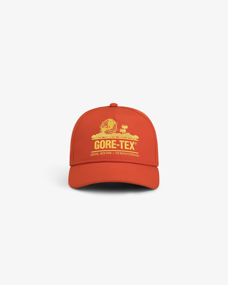 GORE-TEX Unisphere Hat in bright orange with yellow graphic and “GORE-TEX” text, shown on a white background.