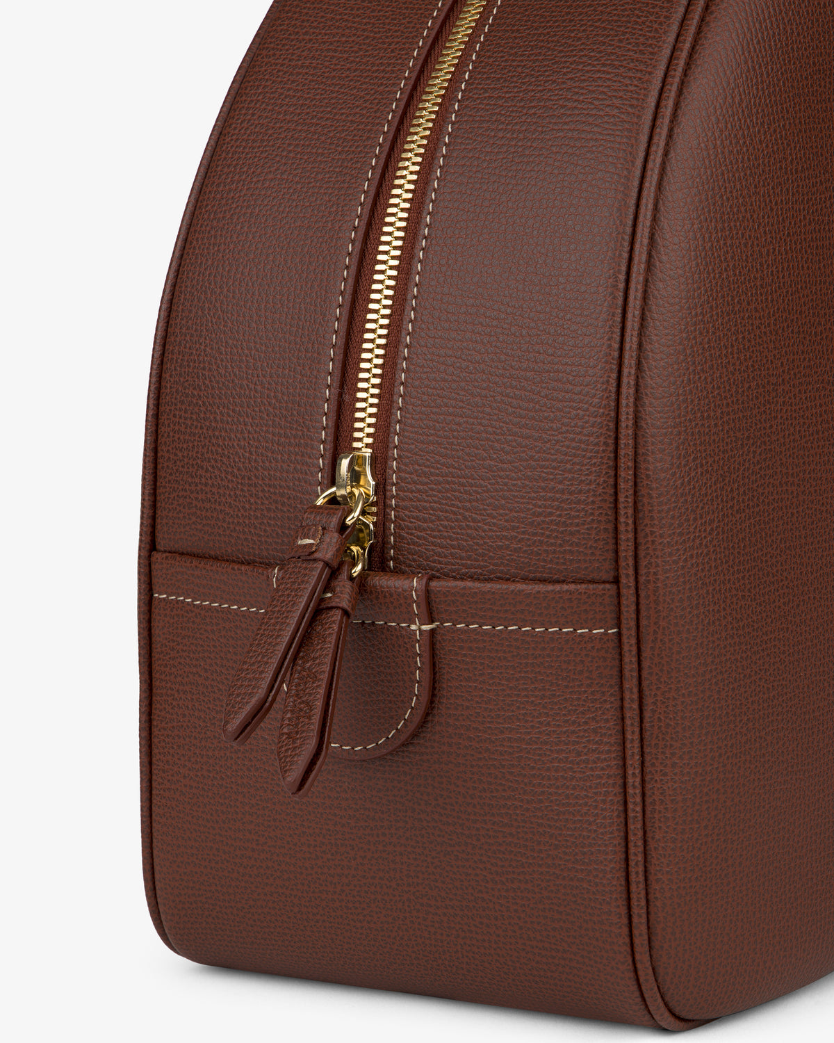Close-up of the Full Grain Leather Crescent Shoulder Bag with gold zipper, white stitching, and two zipper pulls.
