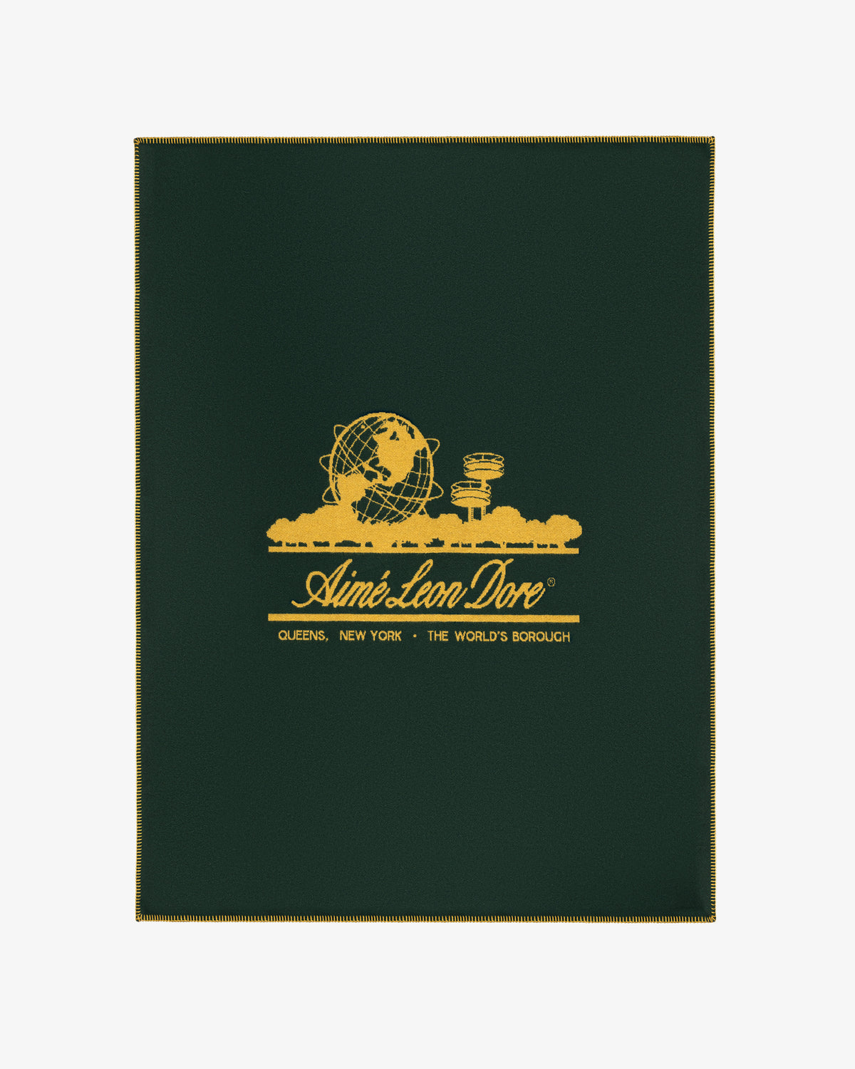 Dark green Unisphere Wool Blanket with gold globe and cityscape graphic, and Aimé Leon Dore text with location details.