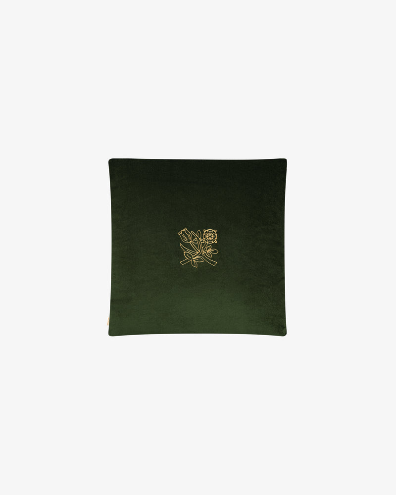 Queens Crest Throw Pillow in dark green features a central gold floral embroidery, displayed on a white background.