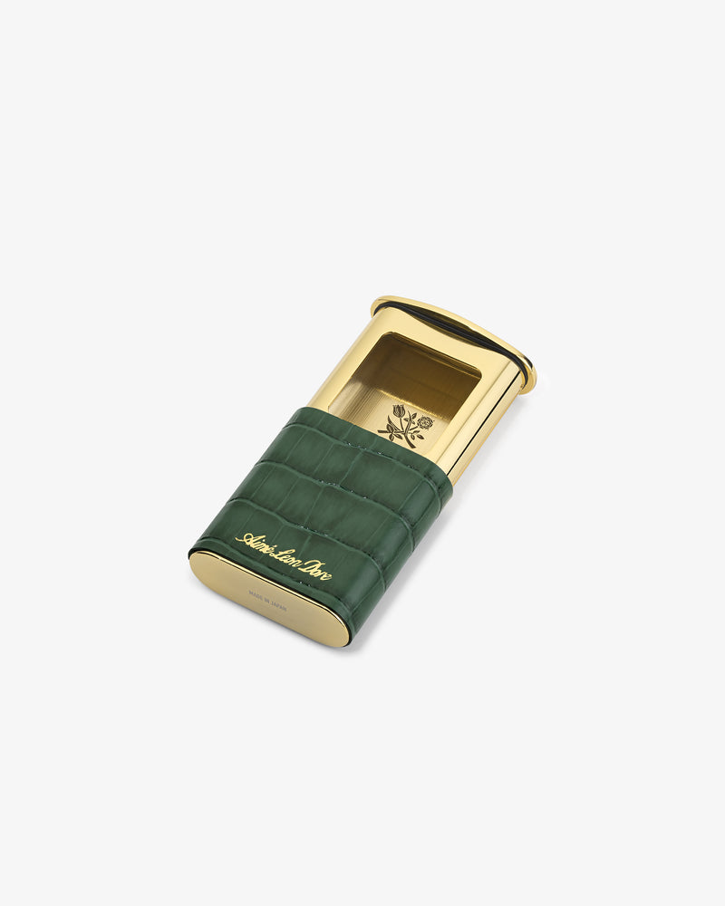 Gold and green Queens Crest Croc Portable Ashtray with crocodile pattern and engraved logo on a white background.