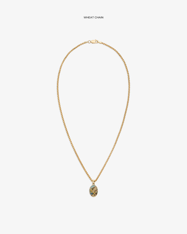 14Kt Gold Molina Pendant on a wheat chain, featuring an oval floral design, displayed on a white background.
