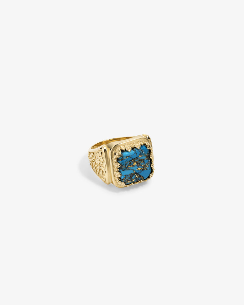 14Kt Gold Turquoise Inlay Ring featuring ornate details and a large, rectangular blue stone with black marbling.