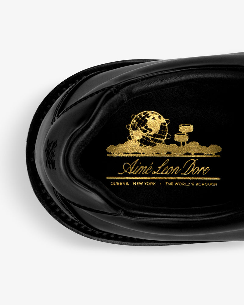 Top view of the Leather Derby Hiker in black with gold Aimé Leon Dore branding and a globe graphic on the insole.