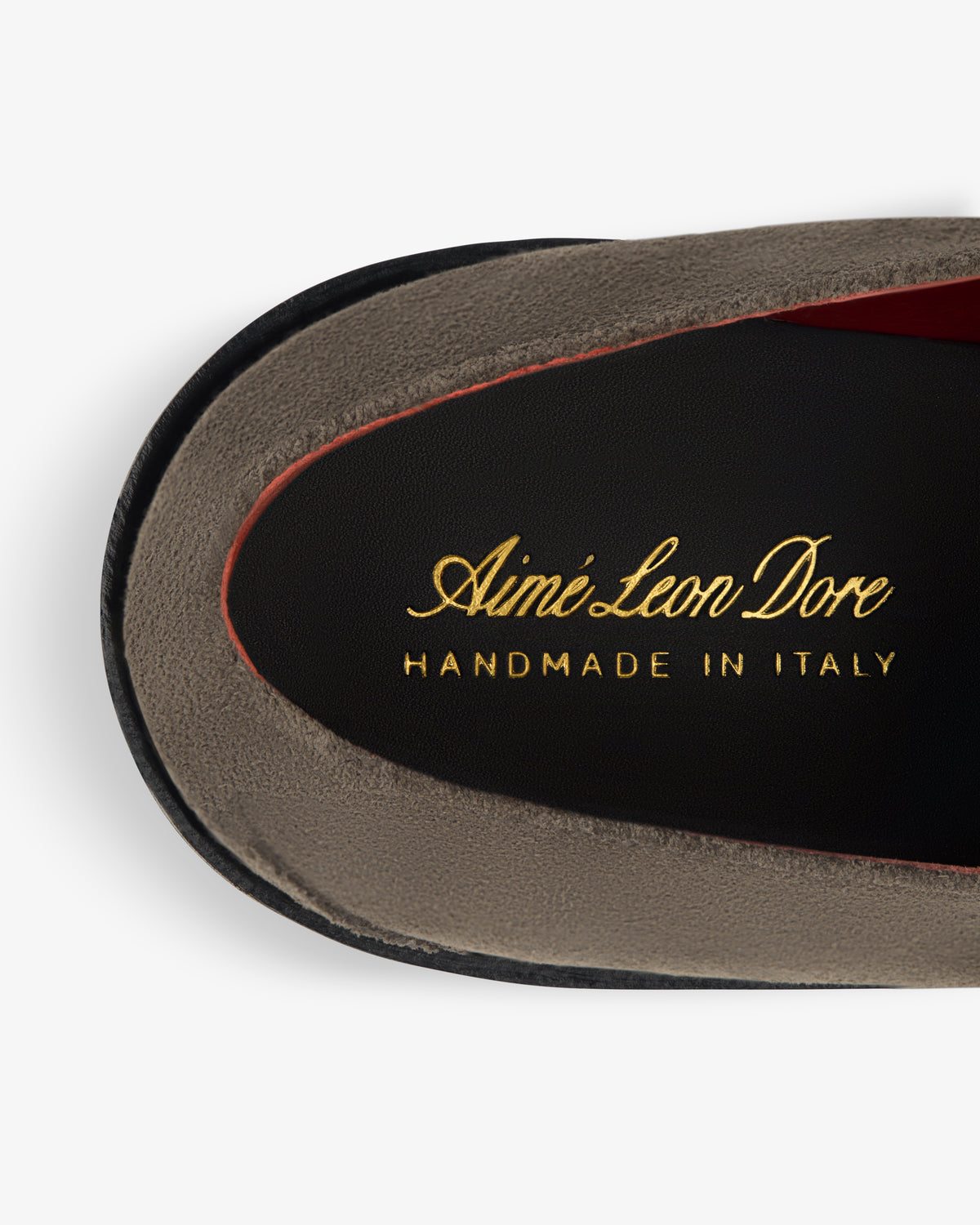 Close-up of a Suede Lug Sole Derby insole with Aimé Leon Dore HANDMADE IN ITALY in gold lettering.