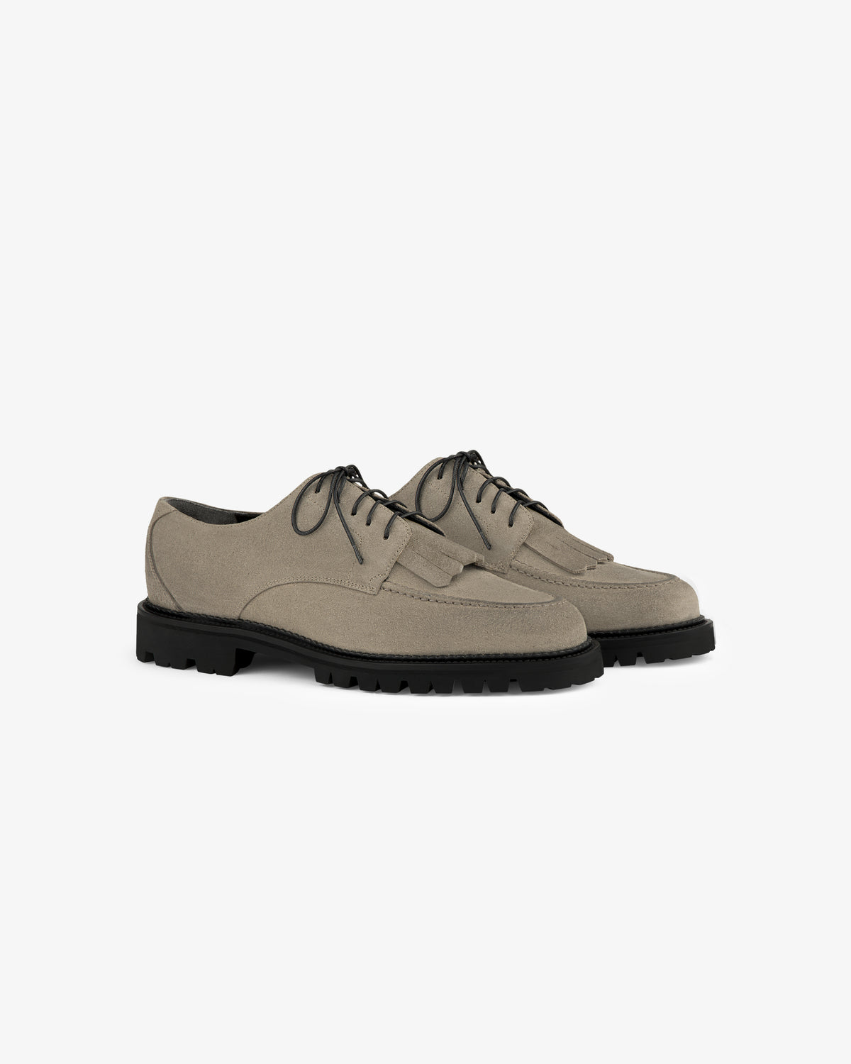 Suede Lug Sole Derby in beige with black soles, lace-up style, shown on a white background.