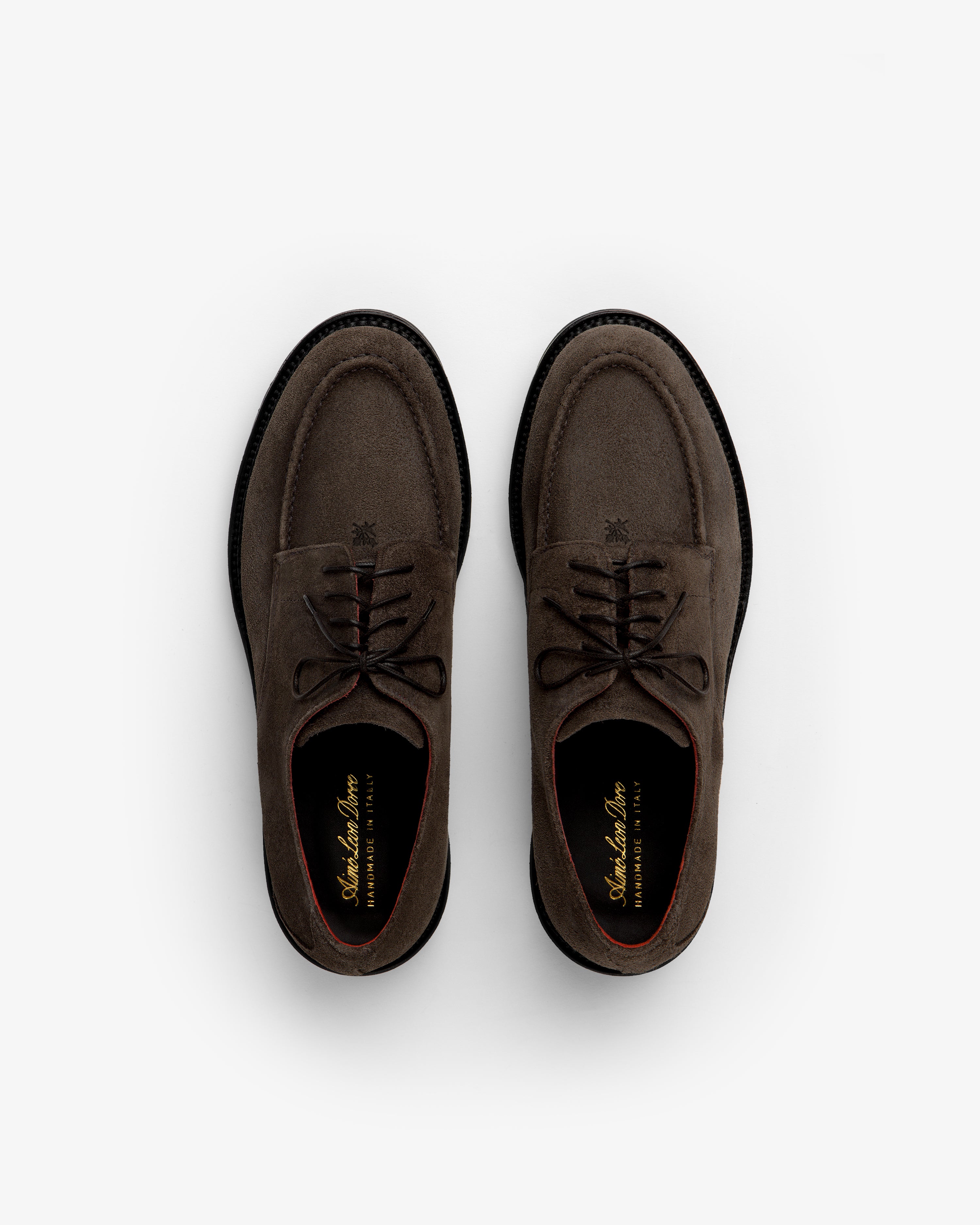 A pair of brown Suede Lug Sole Derby shoes with black lug soles viewed from above.
