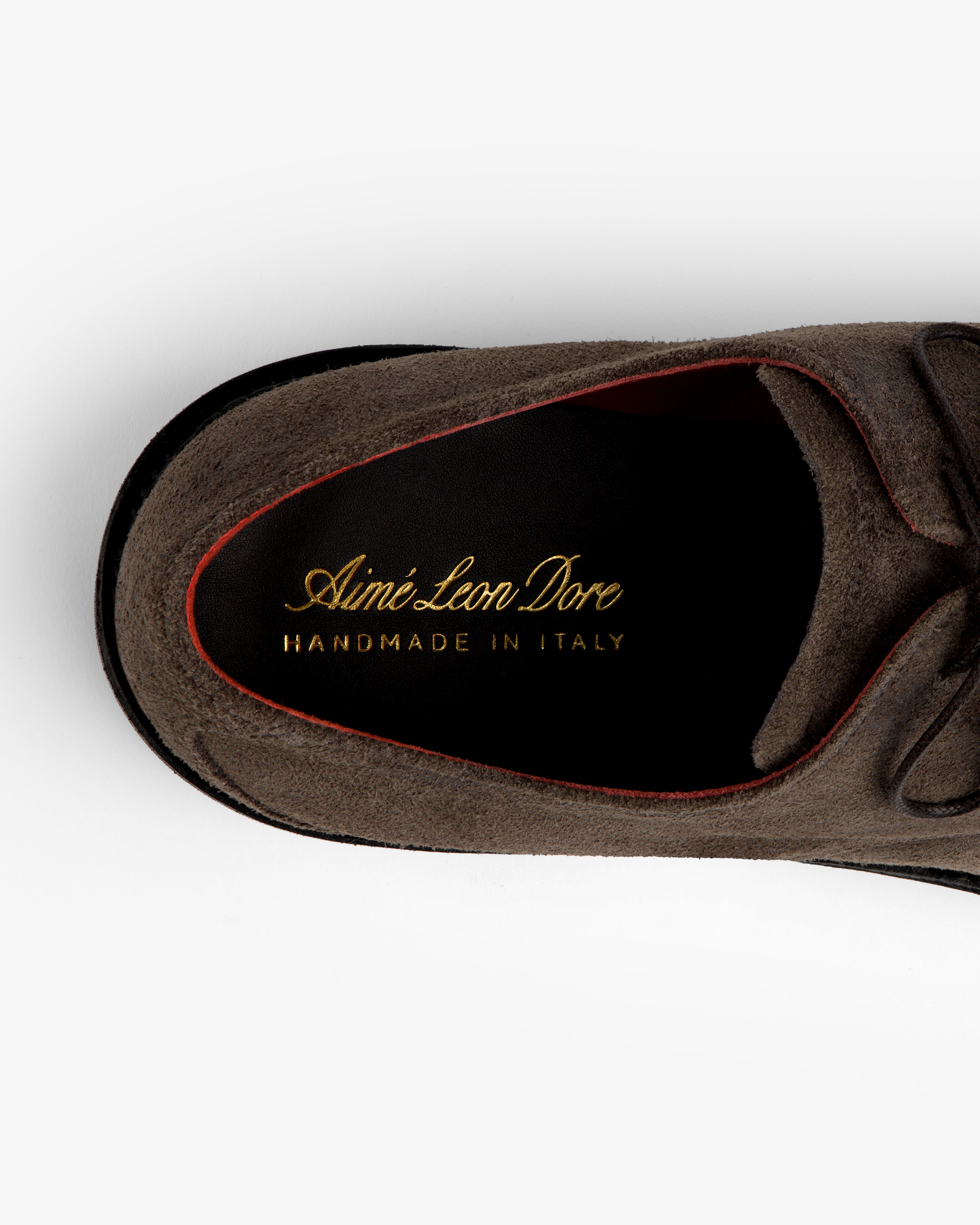 Top-down view of a grey Suede Lug Sole Derby showing the black insole with gold Aimé Leon Dore text.
