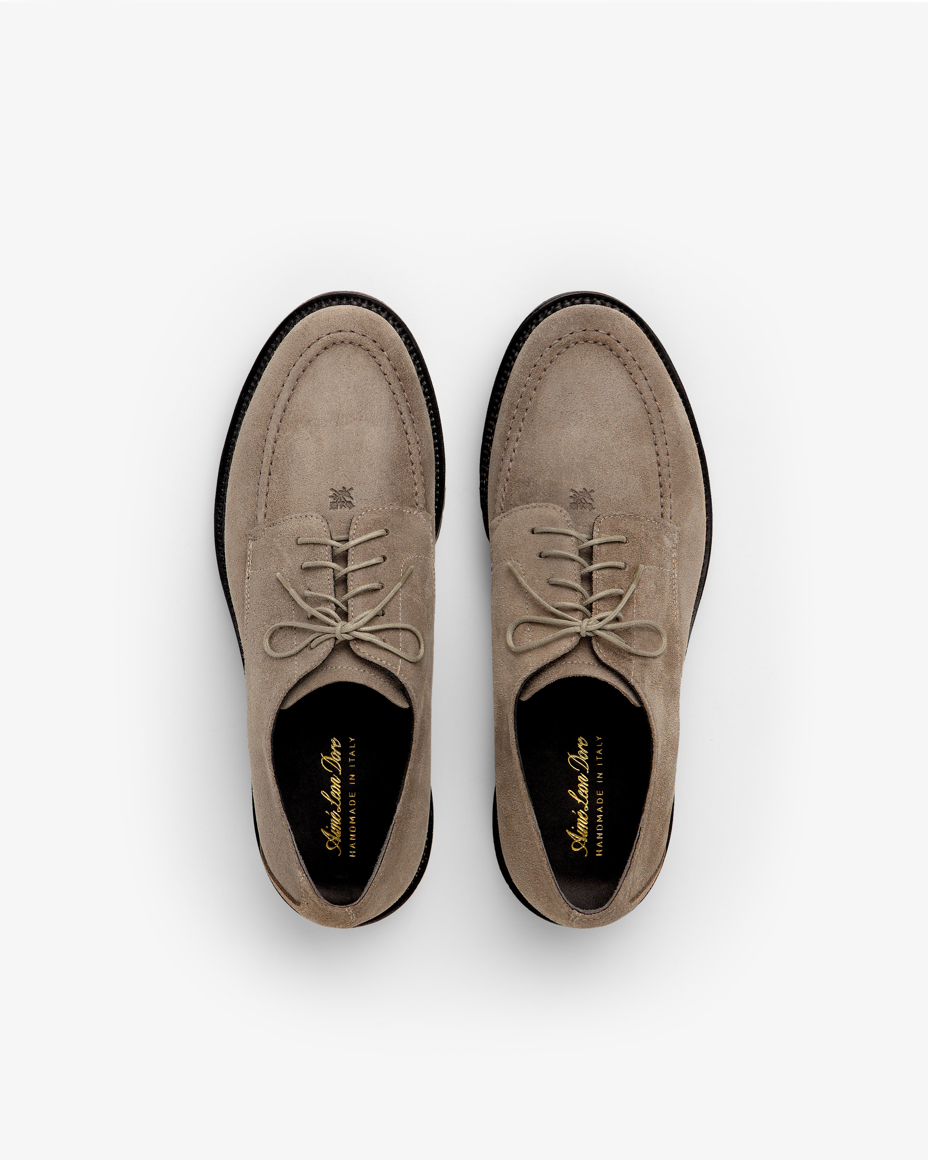 Top-down view of Suede Lug Sole Derby shoes in beige suede with thick black lug soles.