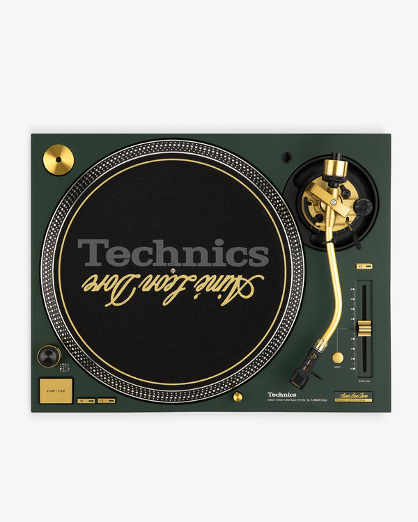 A green and gold ALD / Technics SL-1200M7ALD Turntable with Saint Jhn Love text on the black slipmat.