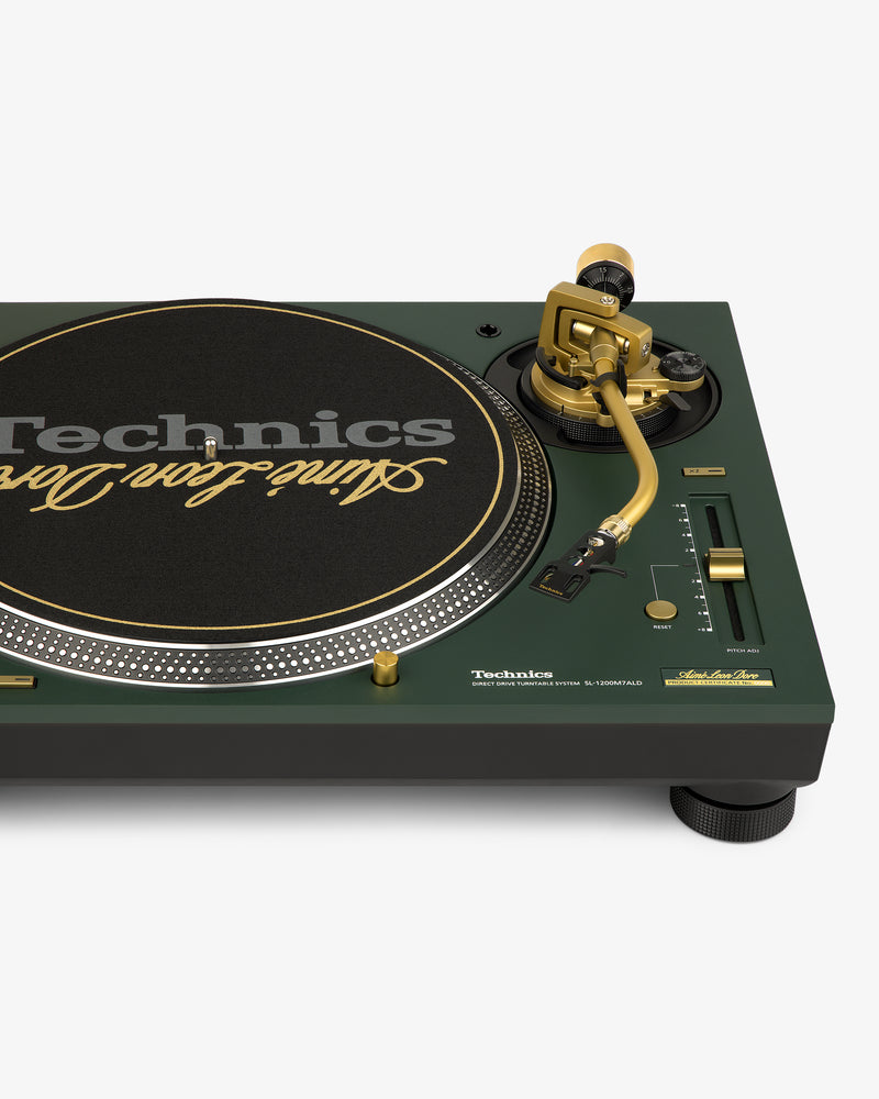 ALD / Technics SL-1200M7ALD Turntable: gold tonearm, gold-accented knobs, black slipmat with gold lettering.