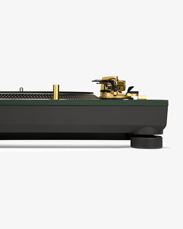 Side view of the ALD / Technics SL-1200M7ALD Turntable with gold and black accents on a white background.