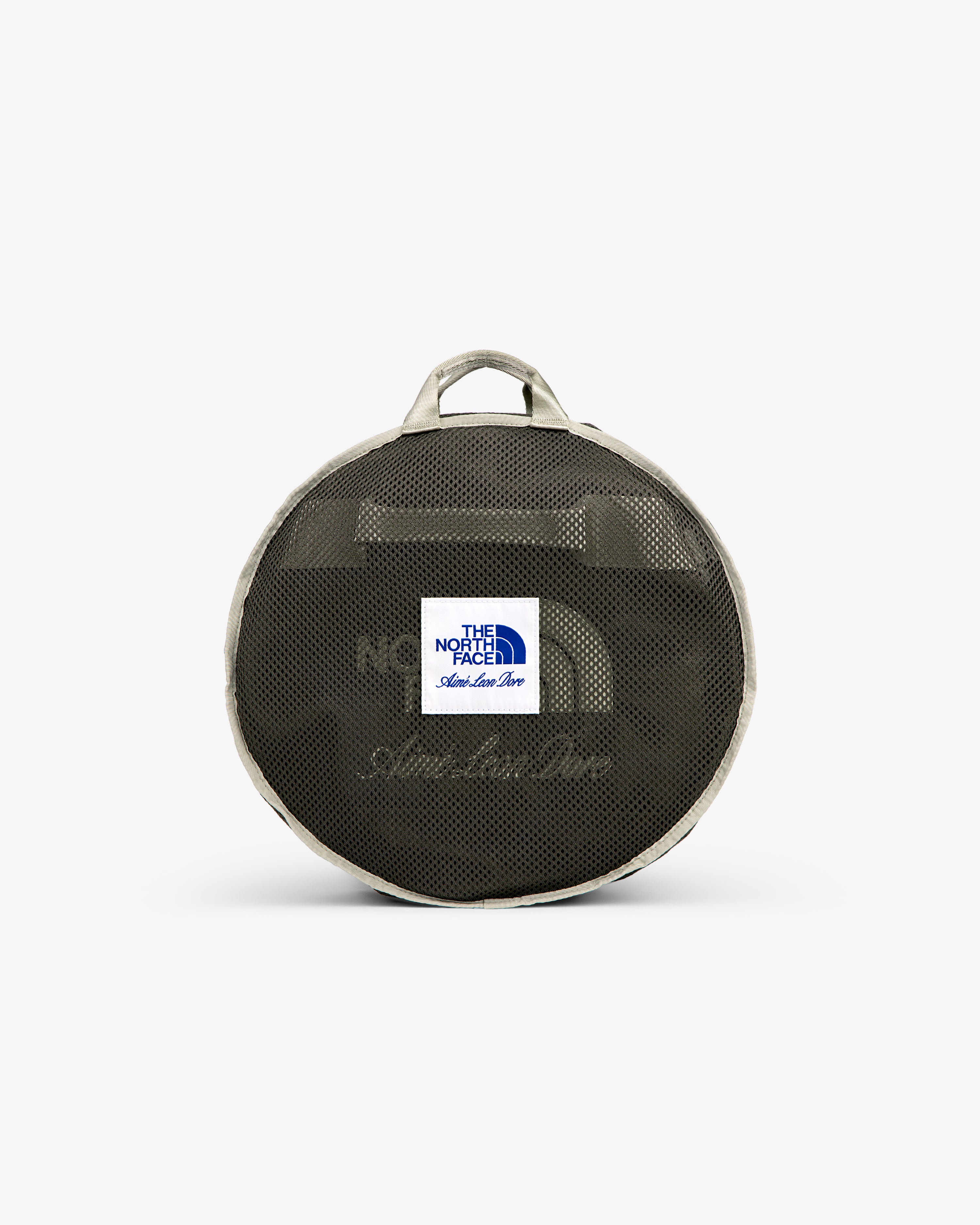 Small round mesh duffel with gray trim, handle, and white “The North Face” label—ALD / The North Face Base Camp Duffel.