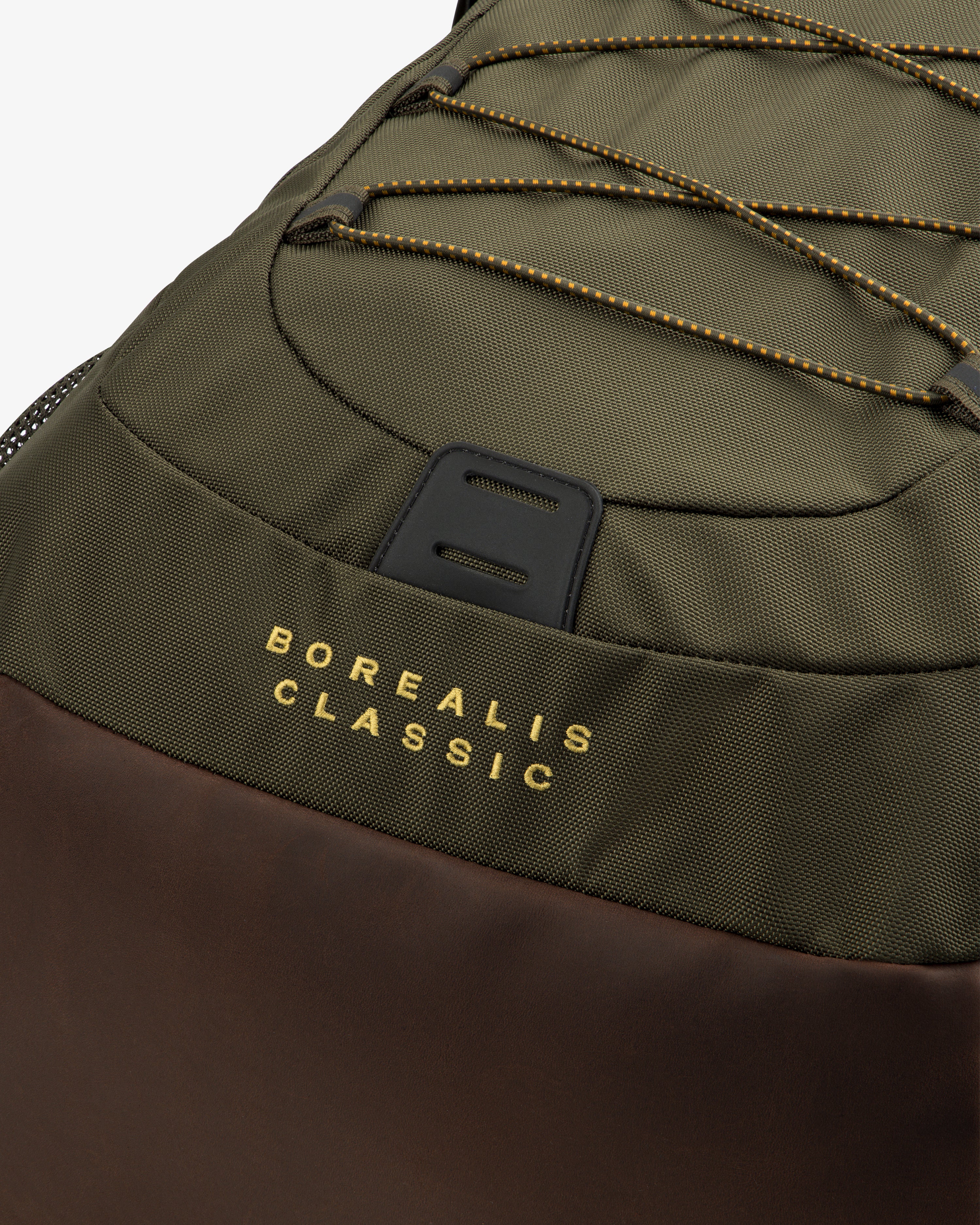 Close-up of the ALD / The North Face Borealis Backpack in olive and brown with yellow branding on the fabric.