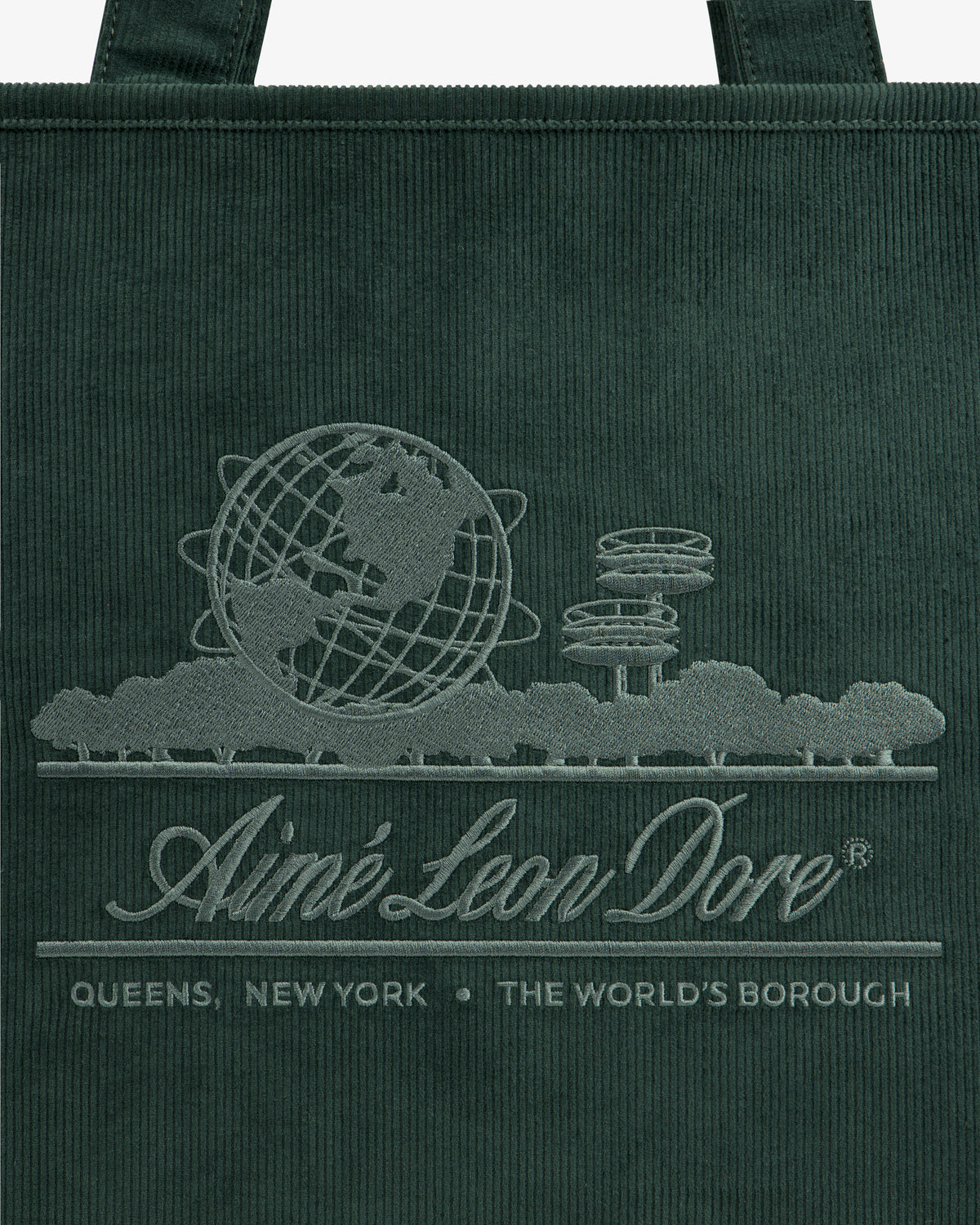 Large Corduroy Unisphere Tote Bag in dark green, embroidered with the Unisphere globe, park trees, and brand text.