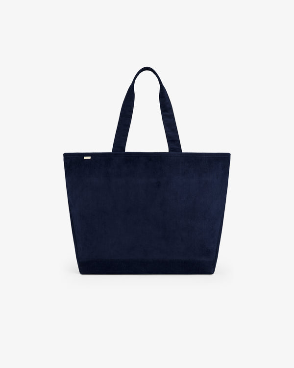 Large Corduroy Unisphere Tote Bag in navy blue corduroy with two shoulder straps.