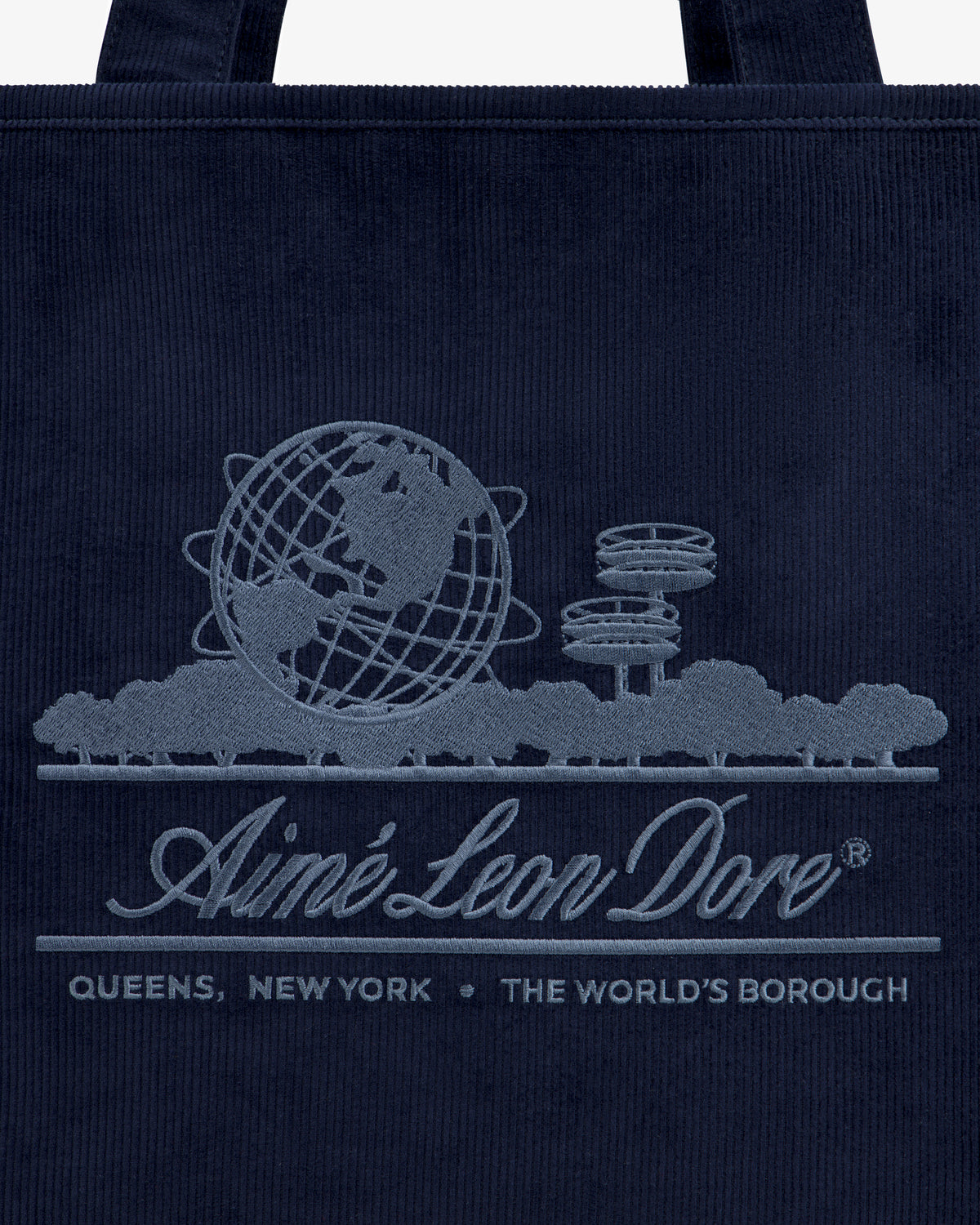 Large Corduroy Unisphere Tote Bag in navy featuring an embroidered Unisphere, trees, and Aimé Leon Dore, Queens, New York.
