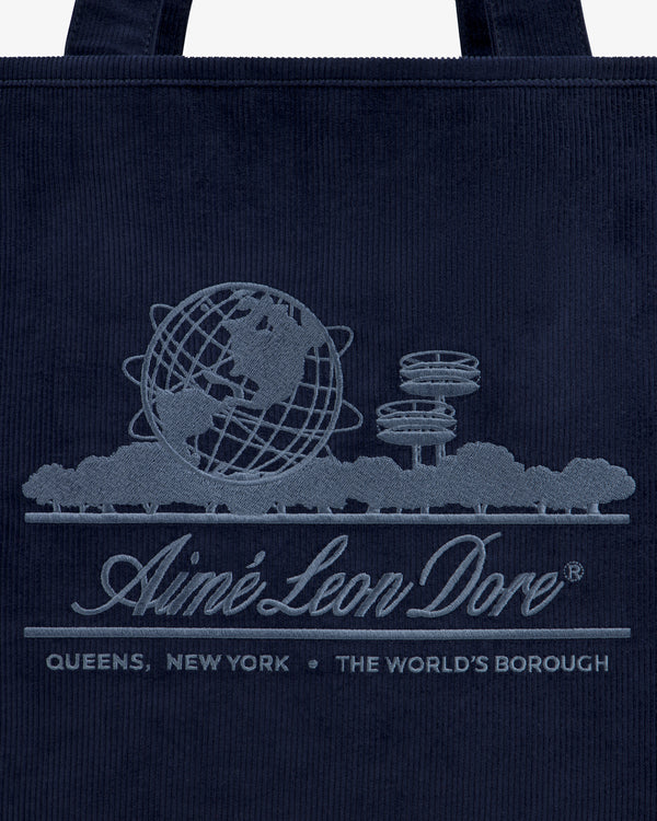 Large Corduroy Unisphere Tote Bag in navy featuring an embroidered Unisphere, trees, and Aimé Leon Dore, Queens, New York.