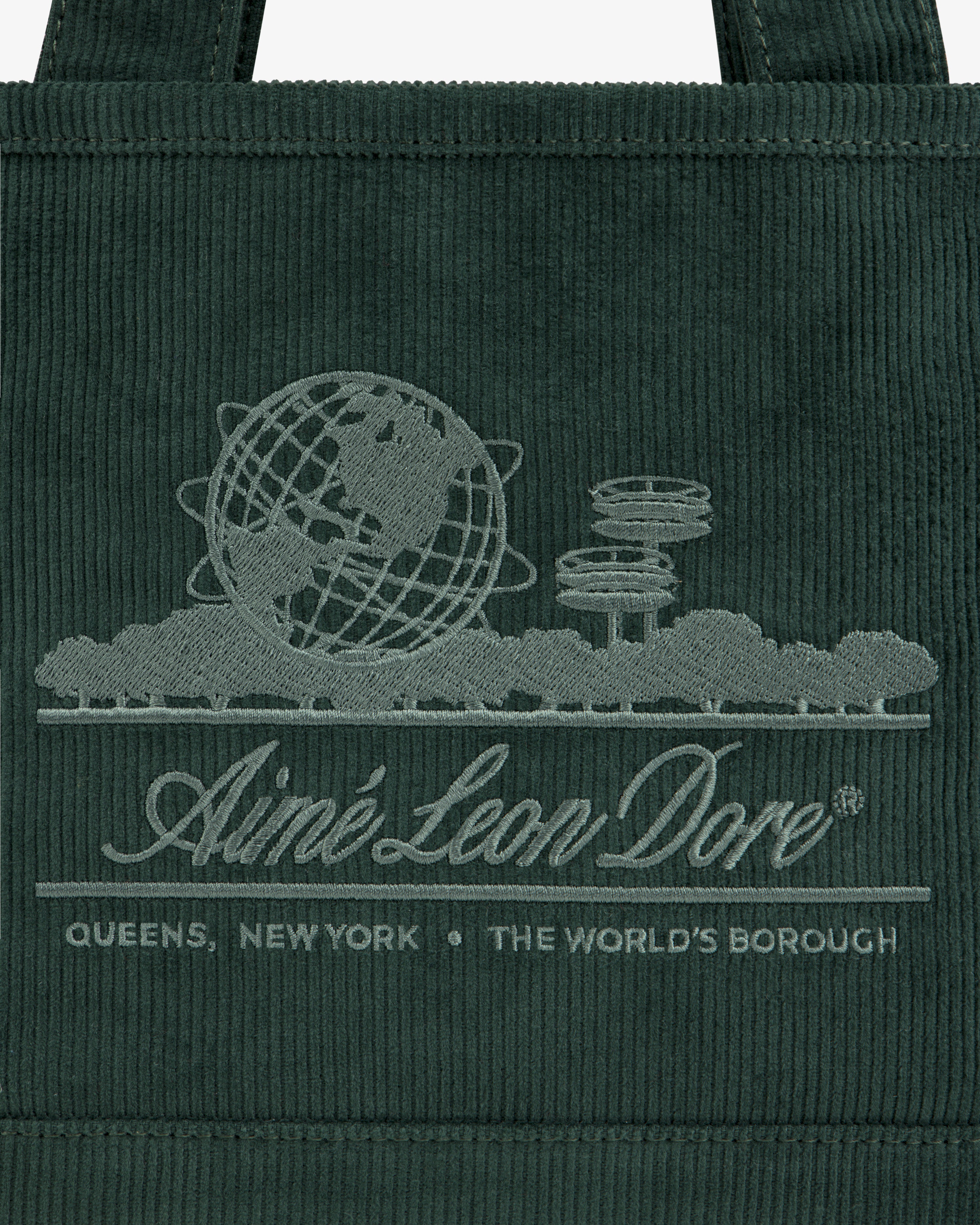 Dark green Mini Corduroy Unisphere Tote Bag featuring an embroidered globe, architectural towers, and Aimé Leon Dore text.
