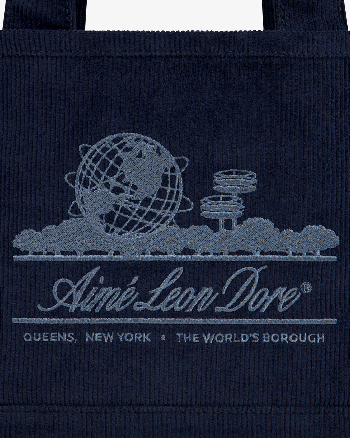 Navy corduroy Mini Corduroy Unisphere Tote Bag featuring an embroidered Unisphere, brand name, and Queens, New York text.