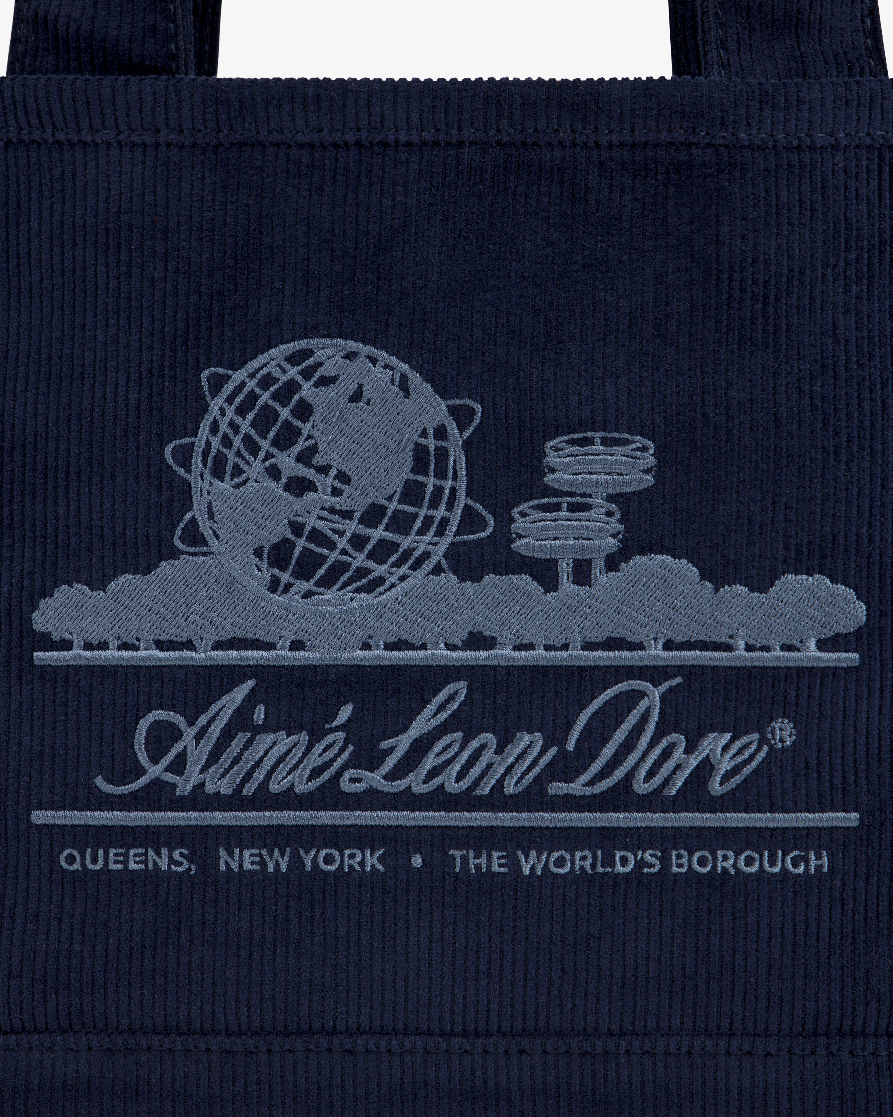 Navy corduroy Mini Corduroy Unisphere Tote Bag featuring an embroidered Unisphere, brand name, and Queens, New York text.