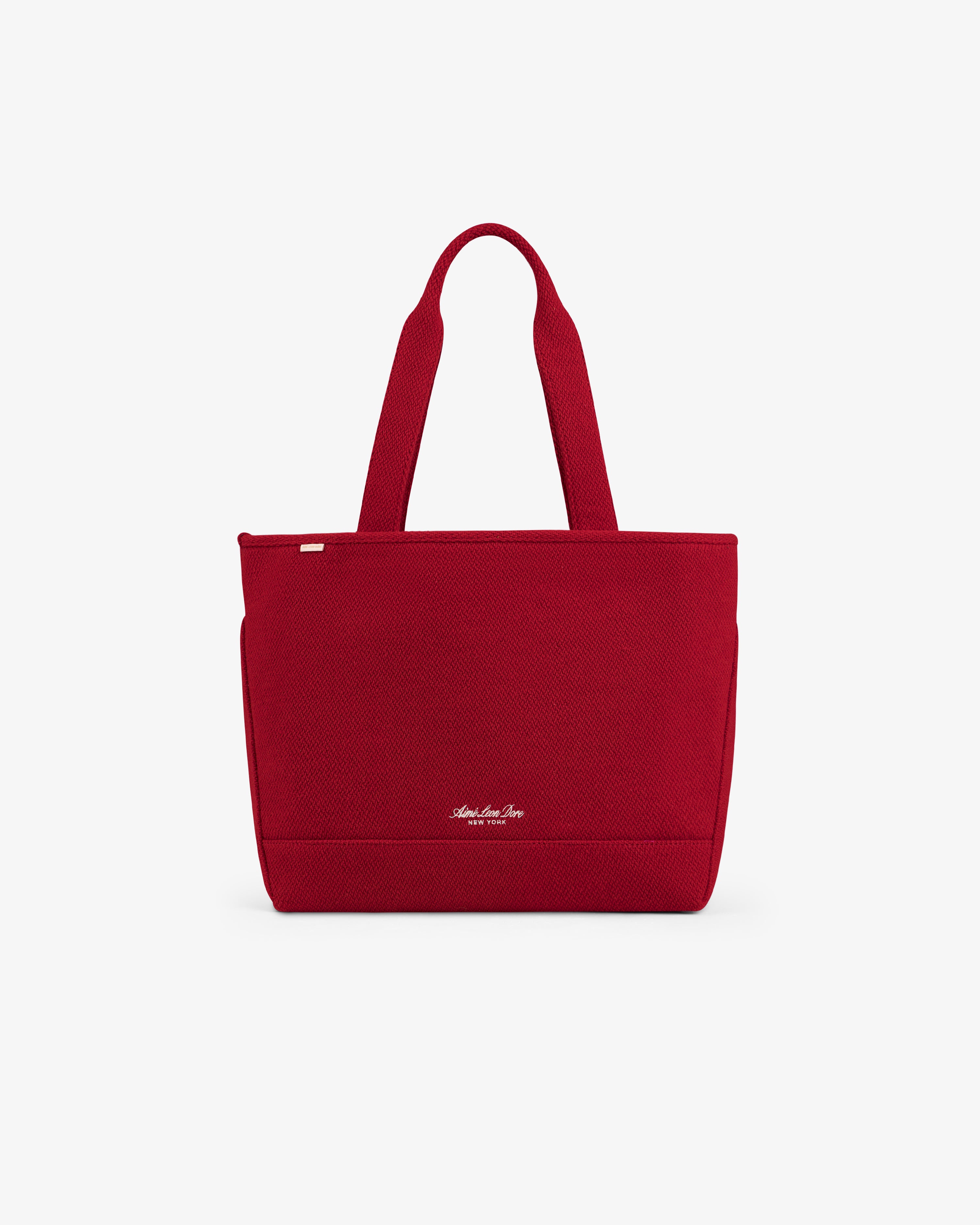 Red textured NY Highlanders Wool Tote Bag with two shoulder straps and small gold-tone lettering near the base.