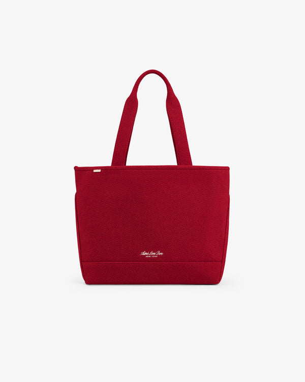 Red textured NY Highlanders Wool Tote Bag with two shoulder straps and small gold-tone lettering near the base.