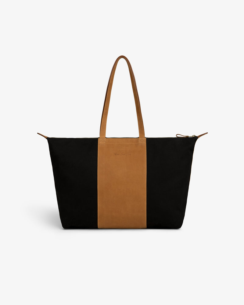 Leather Canvas Zip Tote with black sides, brown center panel, and matching brown handles.