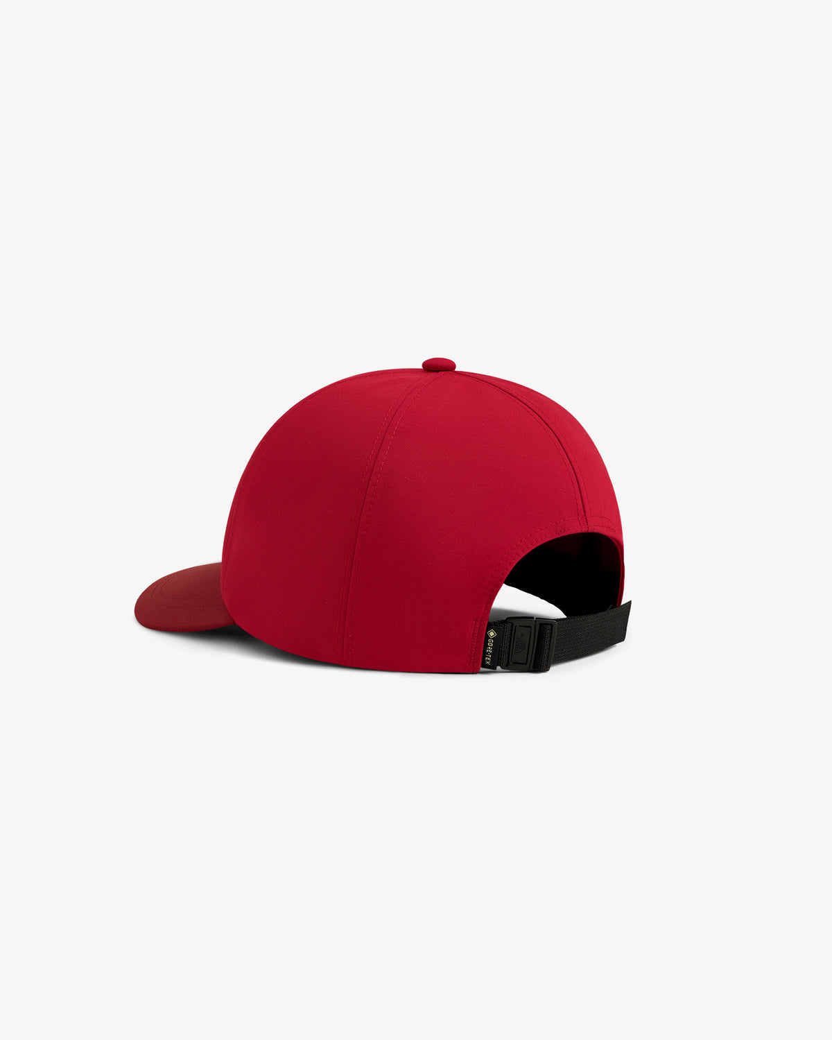 The ALD / The North Face GORE-TEX Hat in red, shown from the back with a black adjustable strap and curved brim.