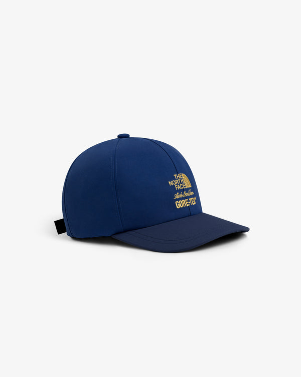 Blue ALD / The North Face GORE-TEX Hat with yellow logo, shown on a white background.