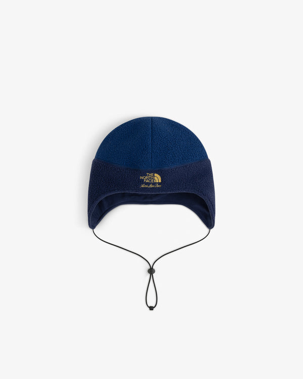 ALD / The North Face Fleece Earflap Hat – blue with black drawstring and front logo.