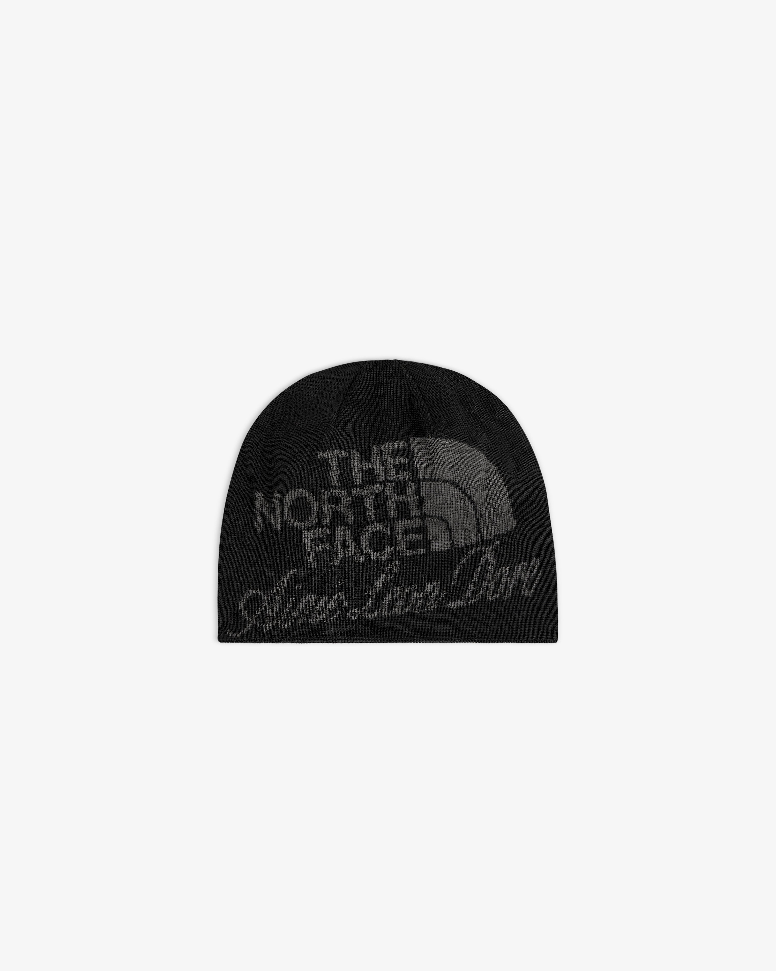ALD / The North Face Jacquard Beanie in black, features both logos in dark gray on the front; shown on white background.