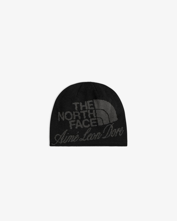 ALD / The North Face Jacquard Beanie in black, features both logos in dark gray on the front; shown on white background.
