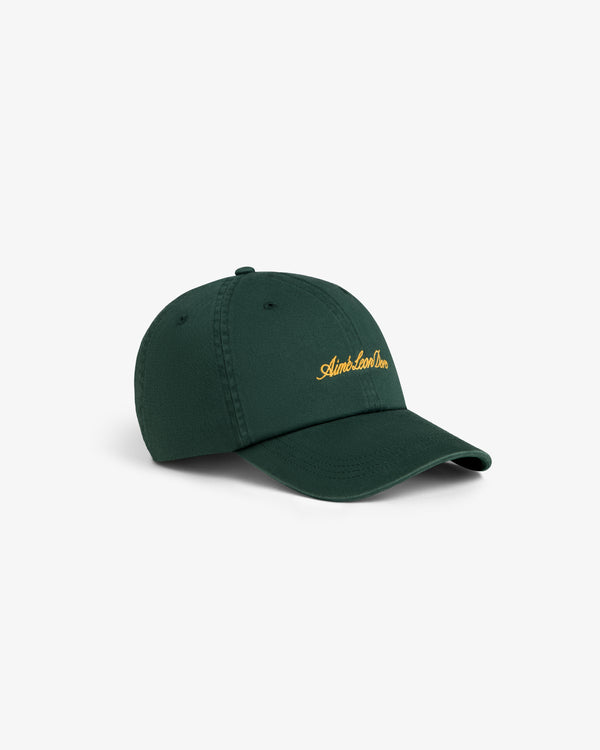 Washed Script Chino Hat in dark green with yellow embroidery, shown on a plain white background.
