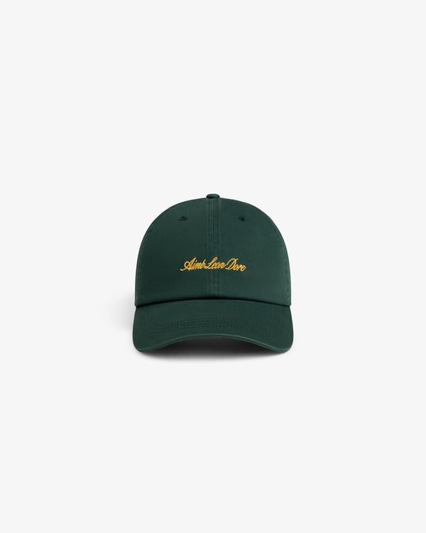Washed Script Chino Hat in dark green with gold Aimé Leon Dore text, displayed on a white background.