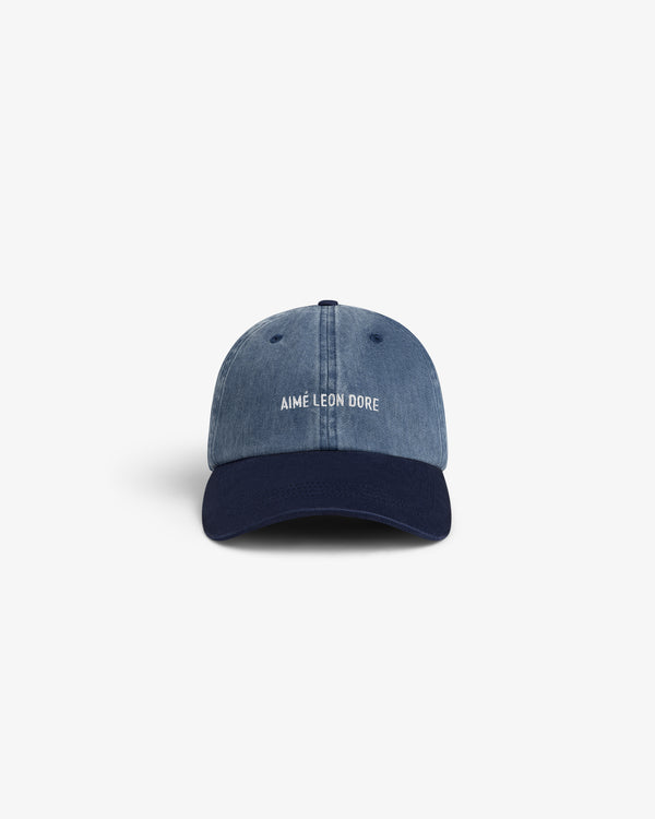 Pigment Dyed Logo Hat in blue denim with navy brim, white AIMÉ LEON DORE embroidery on the front.