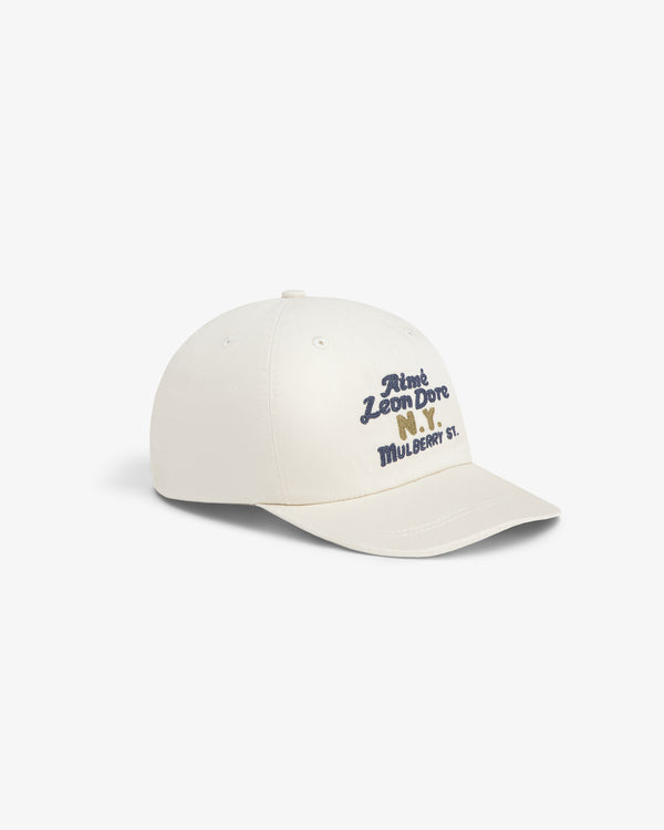 Off-white Mulberry Chainstitch Hat with Aimé Leon Dore N.Y. Mulberry St. embroidered in blue and yellow on front.
