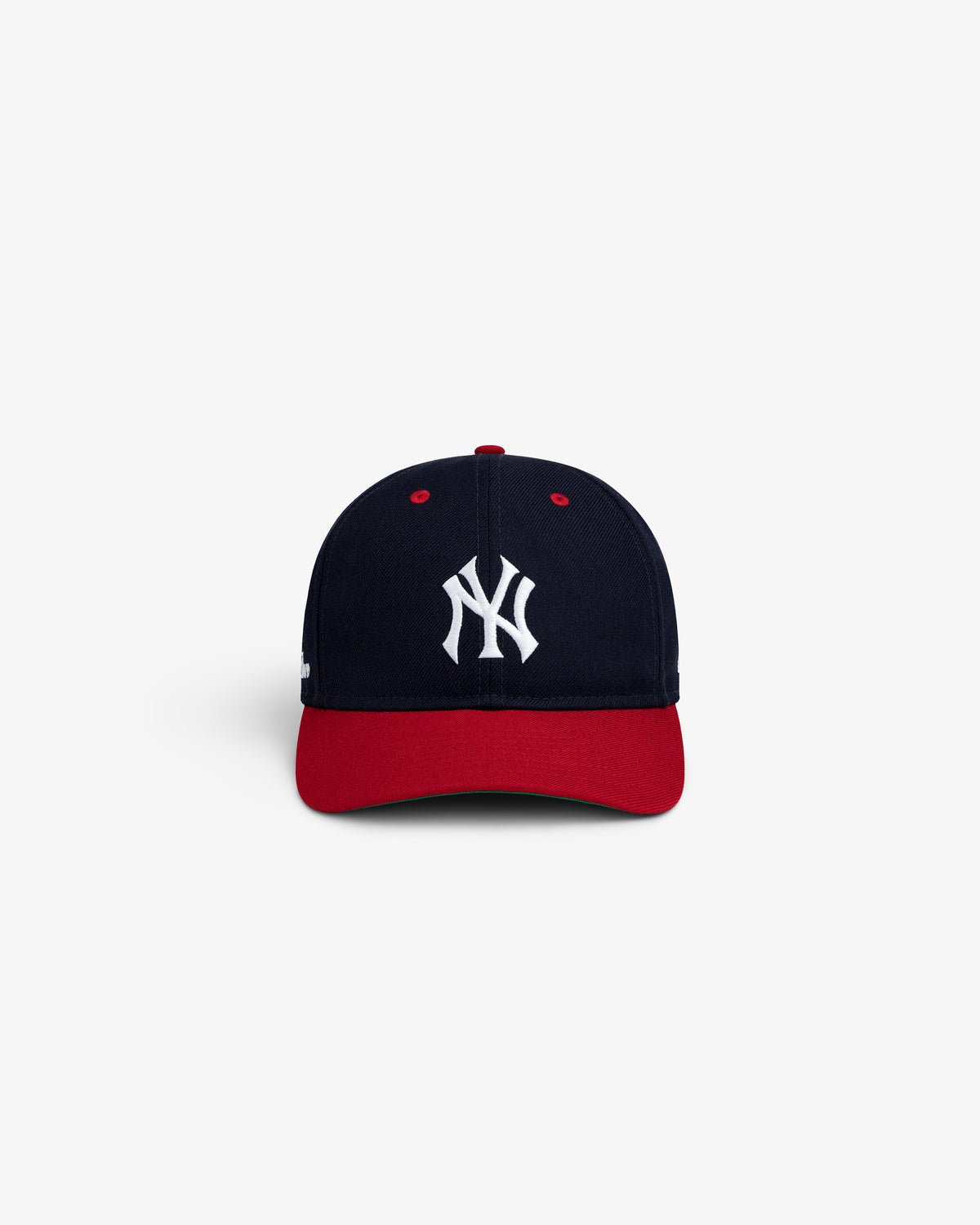 ALD / New Era Yankees Retro Fit Hat: a navy blue baseball cap with a red brim and a white NY logo on the front.