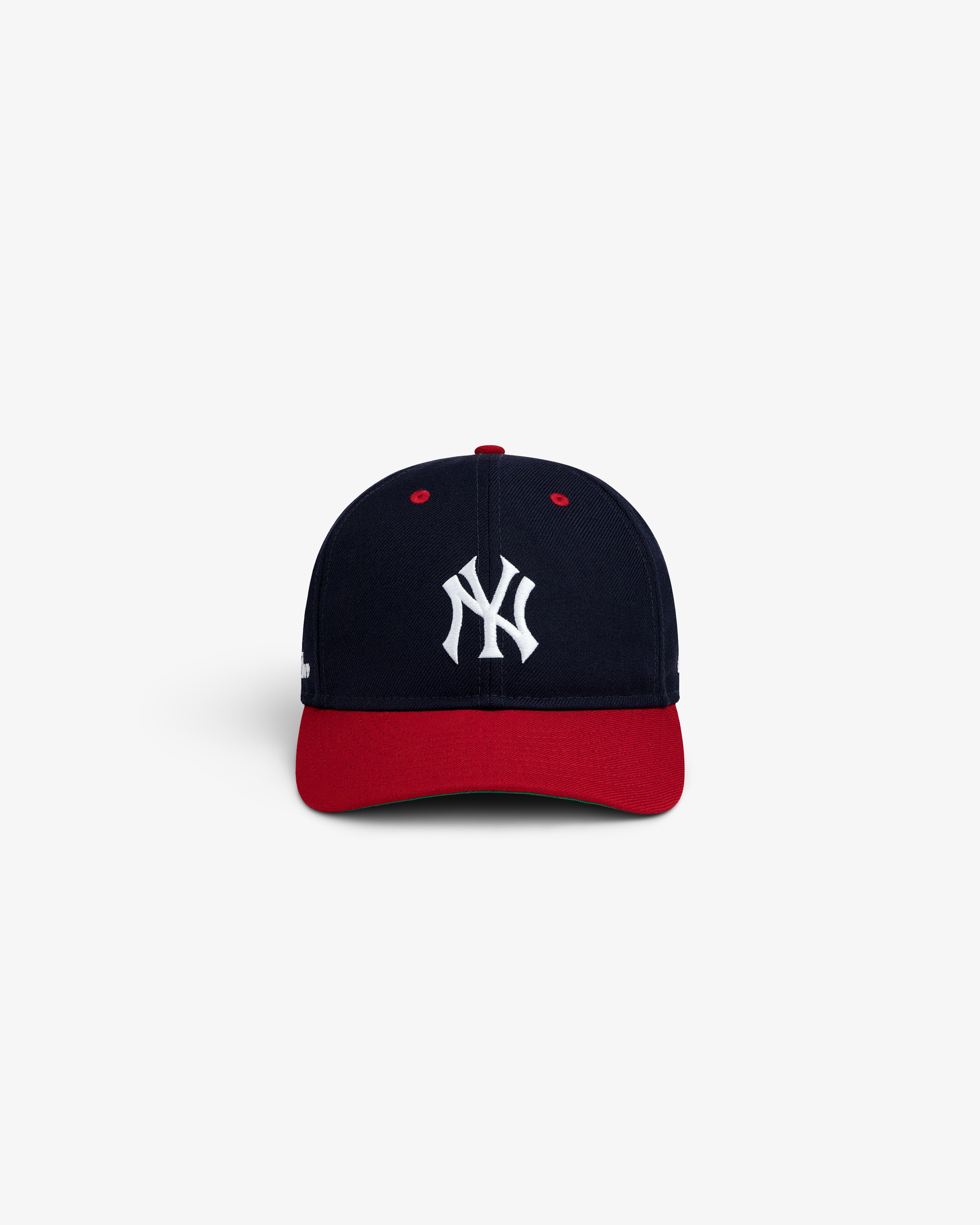 ALD / New Era Yankees Retro Fit Hat: a navy blue baseball cap with a red brim and a white NY logo on the front.