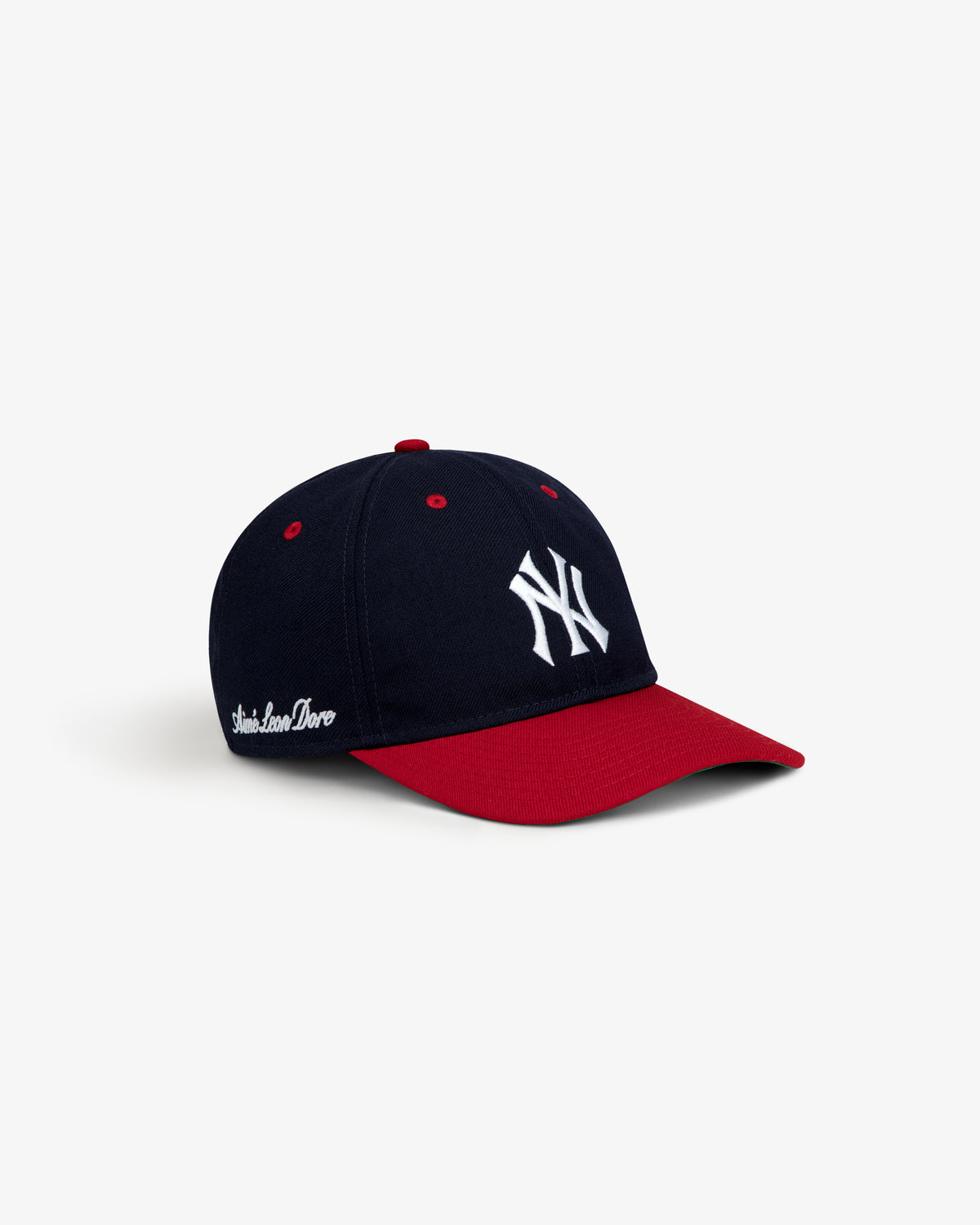 ALD / New Era Yankees Retro Fit Hat: a navy blue baseball cap with a red brim, white Yankees logo, and side text.