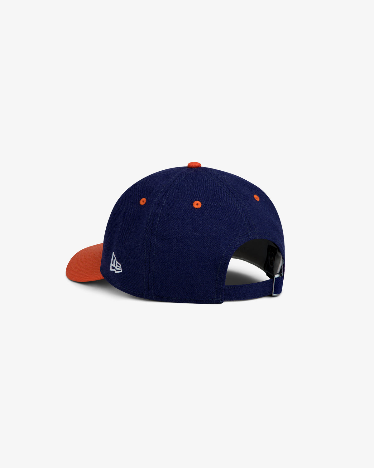ALD / New Era Mets Retro Fit Hat in navy blue with an orange brim and button, featuring a white logo on the side.